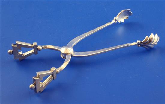 Pair of early 1960s stylish sterling silver sugar tongs by Georg Jensen,(-)